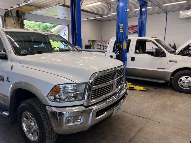 DPF Regeneration Explained: How It Works, Why It Fails and 5 Ways to Prevent Clogs 2 Ram 2500 diesel pickup in the service bay for DPF regeneration diagnostics at Midwest Diesel & Automotive in Hammond, WI