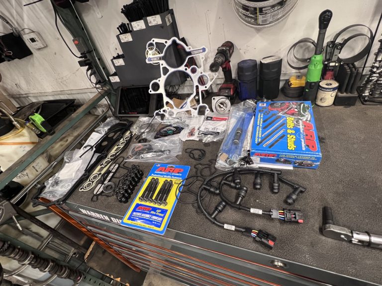 Remanufactured Diesel Engine vs. Rebuilt vs. Used: 7 Questions to Ask Before You Buy 2 Engine parts and gaskets staged for a diesel engine rebuild at Midwest Diesel & Automotive in Hammond, WI