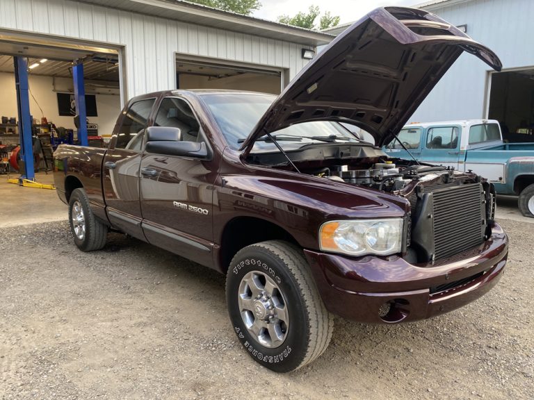 DPF Regeneration Explained: How It Works, Why It Fails and 5 Ways to Prevent Clogs 3 Dodge Ram diesel with the hood open in the bay during an emissions system and DPF inspection in Hammond, WI